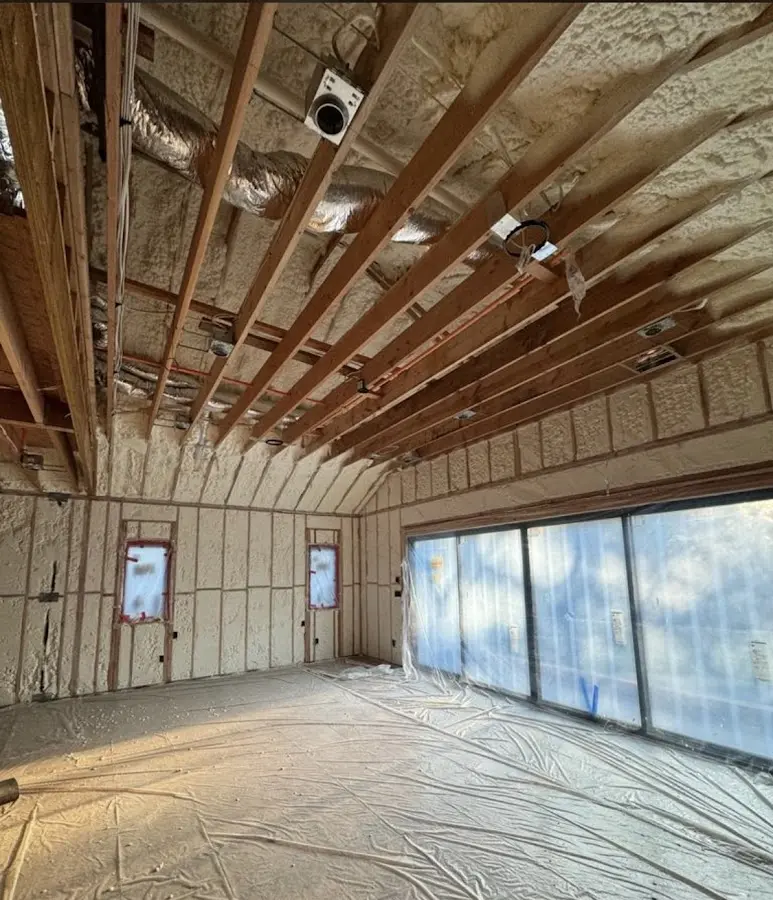 Interior walls and ceiling insulated with spray foam during new construction in Berkley